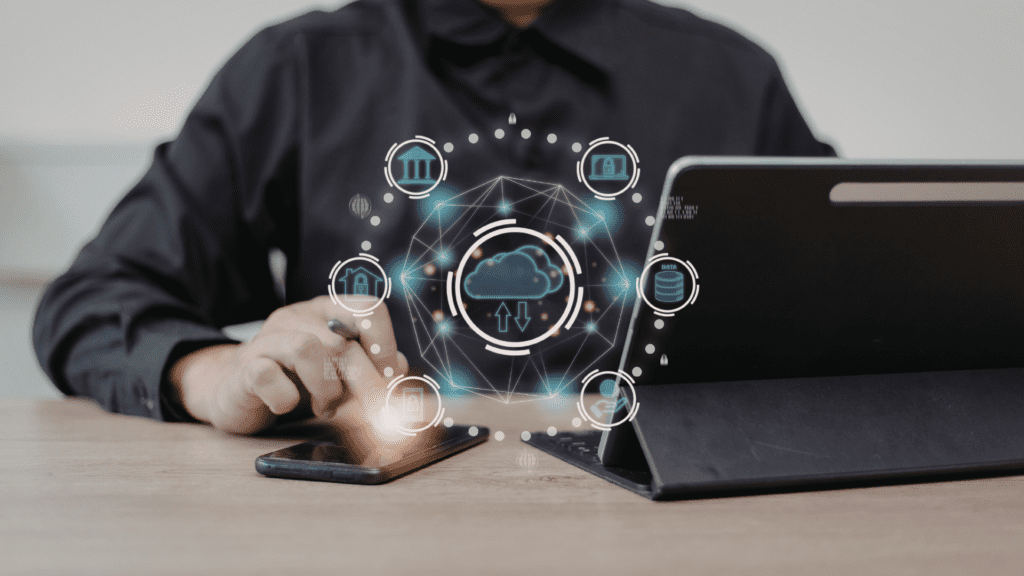 Person at a desk with a tablet, phone and ai icon
